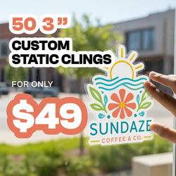 Hand applying a clear custom static cling sticker to a window, featuring a colorful sun, waves, leaves, and flower design with text that reads Sundaze Coffee and Co. Background shows an outdoor storefront scene. Promotional text reads 50 3 inch custom static clings for only 49 dollars