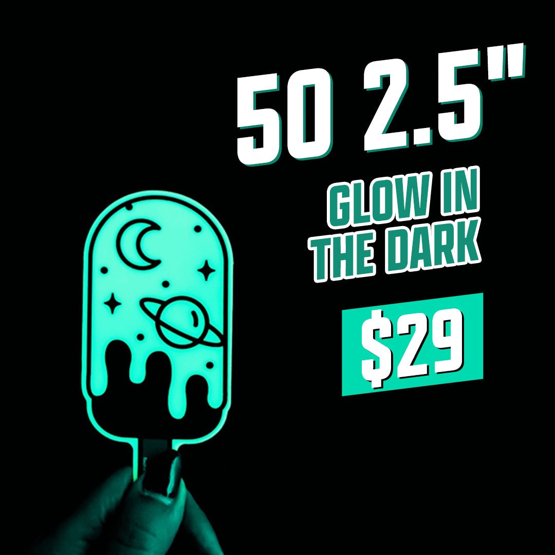 Promotional graphic for 50 glow in the dark 2.5-inch stickers for 29 dollars. A hand holds a glowing teal popsicle-shaped sticker with moon, stars, and planet graphics. Large text on the image reads 50 2.5-inch glow in the dark for 29 dollars.