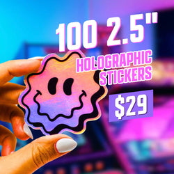 A hand holds a holographic sticker shaped like a wavy-edged smiley face with pink and purple iridescence. The background shows blurred neon arcade lights. On-screen text reads 100 2.5 inch holographic stickers for $29 dollars.