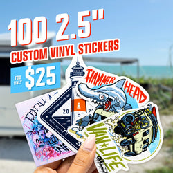 Hand holding four die cut vinyl stickers: an abstract surf-style illustration, a lighthouse badge with coordinates, a cartoon hammerhead shark labeled Hammer Head, and a retro illustrated camper van with text Van Life. Blurred beach and ocean background. On-image text reads 100 2.5 inch custom vinyl stickers for $25. Keywords: surf stickers, adventure decals, shark stickers, beach lifestyle stickers.