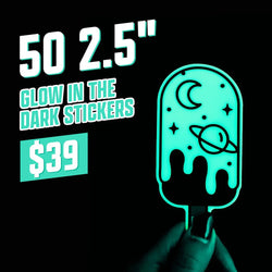 Promotional graphic for 50 2.5-inch glow in the dark stickers for 39 dollars. A glowing teal popsicle-shaped sticker with a crescent moon, planet, and stars is held in the foreground. Large text reads 50 2.5-inch glow in the dark stickers, 39 dollars.