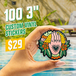 Image of a hand holding a colorful 3 inch sticker featuring an illustrated hand with a heart shape  in the palm surrounded by flowers and decorative patterns on a bright outdoor poolside background. White and green text at the top reads 100 3 inch custom vinyl stickers for $29. Vibrant, folk-art inspired design style.