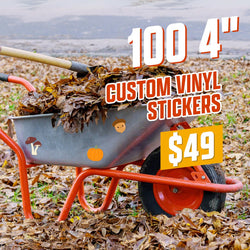 Wheelbarrow filled with dry leaves decorated with small die-cut stickers including mushrooms, a pumpkin, and an acorn character. Leaf-covered autumn ground with overcast background. On-image text reads 100 4 inch custom vinyl stickers for $49. Keywords: fall stickers, seasonal vinyl decals, pumpkin and mushroom stickers.