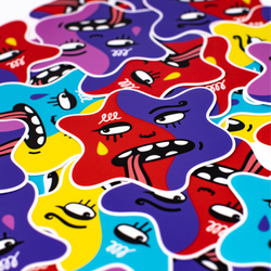 A close-up of colorful star-shaped stickers with cartoon faces in red, purple, blue, yellow, and pink, overlapping on a white background.