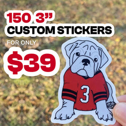 'Promotional graphic advertising 150 custom 3-inch stickers for only $39. Bold red, black, and white text appears over a softly blurred outdoor background. A hand holds a white-bordered die-cut sticker featuring an illustrated gray bulldog wearing a red football jersey with black sleeve stripes and the number '3' on the front.'