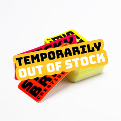 A set of colorful neon stickers with the text 'TEMPORARILY OUT OF STOCK' in bold lettering, stacked on top of each other against a white background.