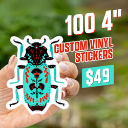 Promotional image advertising custom vinyl stickers, featuring a close-up of a hand holding a 4-inch die-cut beetle sticker designed in a bold folk-art illustration style. The beetle artwork shows detailed symmetrical patterns in turquoise, red, and black with floral motifs and decorative linework, printed on durable white-bordered vinyl. The background displays an outdoor green, natural blur. On-screen text promotes “100 4-inch custom vinyl stickers” for $49. Ideal for showcasing high-quality custom design
