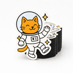 Stack of custom fridge magnets with a cat in an astronaut suit design on a white background