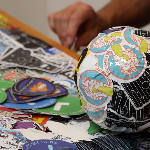 Choosing stickers to add to the world record sticker ball
