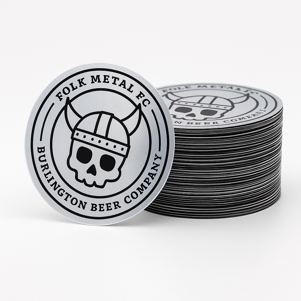 Stack of 'Folk Metal FC Burlington Beer Company' coasters on a white background