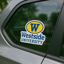 A custom die-cut static window cling is applied to the rear side window of a silver vehicle. The design features a yellow and blue collegiate logo with the text 
