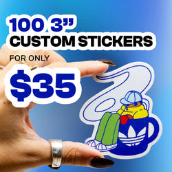 Promotional graphic advertising a custom sticker offer. Text reads as 100 3-inch CUSTOM STICKERS followed by FOR ONLY $35. Bold white and blue text appears over a blue gradient background. A hand holds a die-cut cartoon sticker featuring a seated character wearing a hat and hoodie, resting on a large mug with a trefoil-style logo, showcasing vibrant colors, smooth vinyl finish, and custom sticker quality.