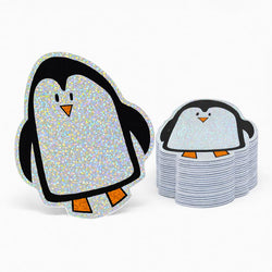 Holographic glitter penguin stickers on a white background
