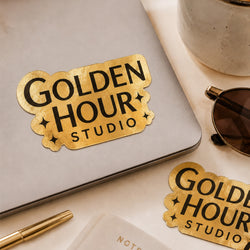 A brushed gold metallic sticker reading 