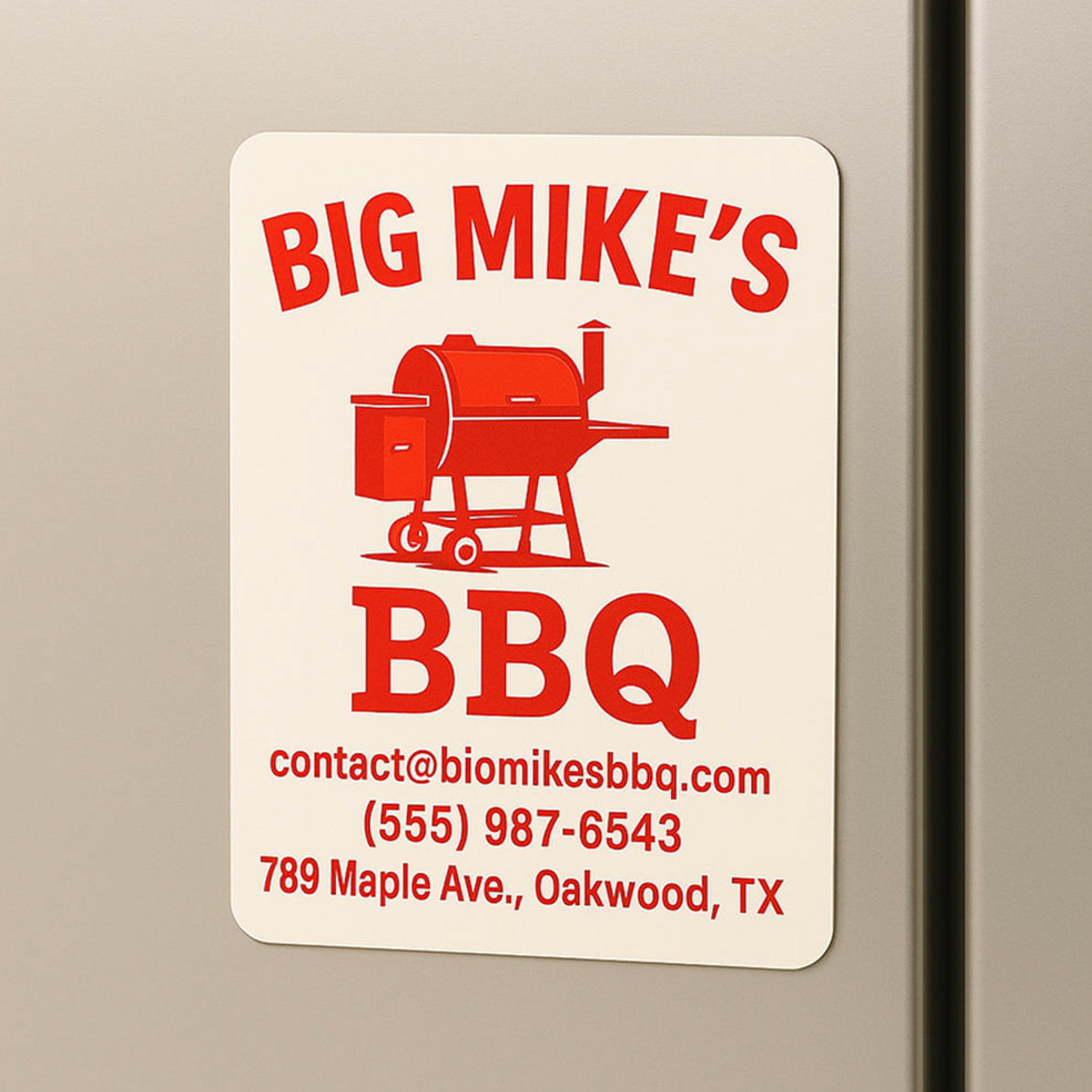 A square custom refrigerator magnet displays the text "BIG MIKE'S BBQ" above a red barbecue grill illustration. Additional text reads "contact@biomikesbbq.com," "(555) 987-6543," and "789 Maple Ave., Oakwood, TX." The magnet demonstrates promotional business magnets with contact information for restaurants and local businesses.