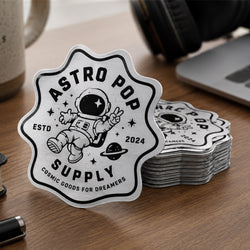 A brushed silver metallic sticker features the logo 