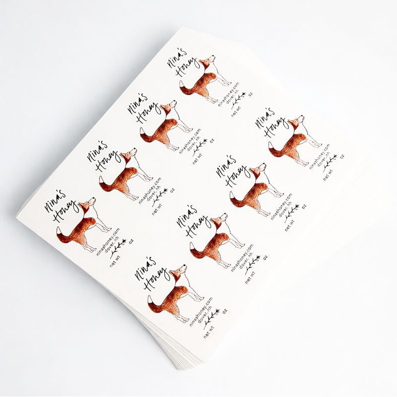 Sheet of stickers with fox shiba inu illustrations and 'Nina's Honey' text on a white background