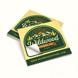 Two Wildwood Apparel Co. kiss cut stickers on a white background pale yelow green and rust