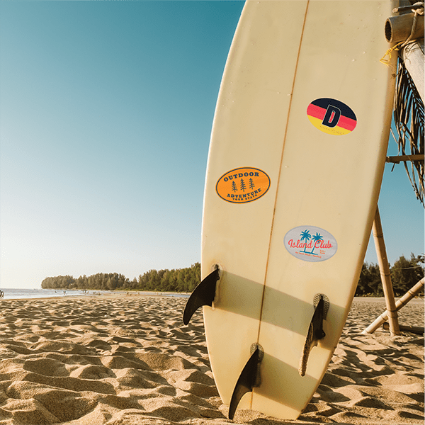 Surfboard with 3 custom surfboard sticker decals